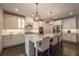 Spacious kitchen with granite counters, stainless appliances, a large island with seating, and stylish pendant lighting at 3825 Valleyway Rd, Cumming, GA 30040