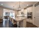 Bright kitchen features a large center island, granite countertops, and stainless steel appliances at 3825 Valleyway Rd, Cumming, GA 30040