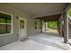 Covered back patio with gray siding, dark wood supports, and walk out access to backyard at 3825 Valleyway Rd, Cumming, GA 30040