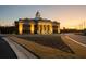 Beautiful sunset view of Auburn Oaks Cultural Center at dusk at 41 Hydrangea Unit 73 Ln, Auburn, GA 30011