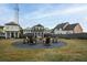 Inviting community fire pit with Adirondack chairs for outdoor gatherings at 41 Hydrangea Unit 73 Ln, Auburn, GA 30011
