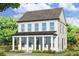 Charming two-story home with a welcoming front porch and classic architectural details at 41 Hydrangea Unit 73 Ln, Auburn, GA 30011