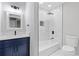 Modern bathroom with vanity, shower, tub and toilet featuring clean, bright finishes at 4657 Lou Ivy Rd, Peachtree Corners, GA 30096