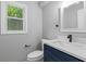 Updated bathroom featuring a modern vanity with a quartz countertop at 4657 Lou Ivy Rd, Peachtree Corners, GA 30096