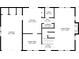 Detailed first floor layout featuring a living room, kitchen, dining area, garage, and other rooms at 4657 Lou Ivy Rd, Peachtree Corners, GA 30096