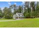 Well-maintained home with a lush front lawn and a convenient attached garage, offering curb appeal and practicality at 4657 Lou Ivy Rd, Peachtree Corners, GA 30096