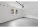 Spacious garage with painted floor and walls offering ample storage and utility space at 4657 Lou Ivy Rd, Peachtree Corners, GA 30096