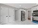 Kitchen boasts stainless refrigerator and new cabinets with modern hardware at 4657 Lou Ivy Rd, Peachtree Corners, GA 30096