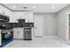Newly renovated kitchen with stainless steel appliances and stylish subway tile backsplash at 4657 Lou Ivy Rd, Peachtree Corners, GA 30096