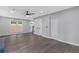 View of the living room, featuring hardwood floors, neutral paint, and ample natural light at 4657 Lou Ivy Rd, Peachtree Corners, GA 30096