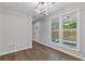 Spacious living room with large windows and a view of the front yard at 4657 Lou Ivy Rd, Peachtree Corners, GA 30096
