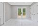 Living space with gleaming floors and a view of the backyard deck at 4657 Lou Ivy Rd, Peachtree Corners, GA 30096