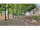 Backyard featuring mature trees and a grassy area at 4954 Penscot Way, Stone Mountain, GA 30088