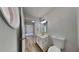 Well-maintained half bathroom featuring modern fixtures and a tile floor at 4954 Penscot Way, Stone Mountain, GA 30088