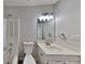 Bathroom featuring a single sink vanity and tub-shower combo at 4954 Penscot Way, Stone Mountain, GA 30088