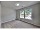 Cozy carpeted bedroom featuring double windows and a neutral color palette at 4954 Penscot Way, Stone Mountain, GA 30088