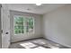 Carpeted bedroom with double windows offering a pleasant view at 4954 Penscot Way, Stone Mountain, GA 30088