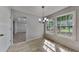 Bright dining space featuring tile flooring, large windows and neutral walls at 4954 Penscot Way, Stone Mountain, GA 30088