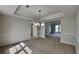 Inviting dining room with plush carpet, tray ceiling, and an elegant chandelier at 4954 Penscot Way, Stone Mountain, GA 30088