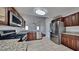 Modern kitchen with stainless steel appliances, granite countertops and dark wood cabinets at 4954 Penscot Way, Stone Mountain, GA 30088