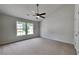 Spacious main bedroom with plush carpet, neutral walls and an abundance of light at 4954 Penscot Way, Stone Mountain, GA 30088