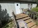Back porch featuring stairs, railings, plants, and access to the main house at 6722 Heardsville Rd, Cumming, GA 30028