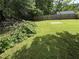 A large backyard featuring beautiful green grass at 6722 Heardsville Rd, Cumming, GA 30028