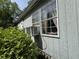Exterior home detail with a large window and small air conditioning unit at 6722 Heardsville Rd, Cumming, GA 30028
