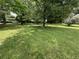 Grassy front yard with shade trees at 6722 Heardsville Rd, Cumming, GA 30028