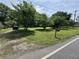 Beautiful front yard with mature trees, lush green grass, and mailbox at 6722 Heardsville Rd, Cumming, GA 30028