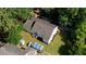 Aerial view showcases the property's backyard, including a detached garage and mature trees at 1149 Avondale Se Ave, Atlanta, GA 30312