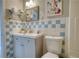 Bathroom featuring blue and white tile and a light gray vanity at 1149 Avondale Se Ave, Atlanta, GA 30312