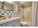 This bathroom features a tub and shower, along with an updated vanity and mirror at 1149 Avondale Se Ave, Atlanta, GA 30312