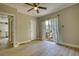Bedroom with sliding doors to small deck and ceiling fan at 1149 Avondale Se Ave, Atlanta, GA 30312