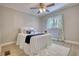Bedroom featuring a cozy bed, light-colored walls, and a ceiling fan at 1149 Avondale Se Ave, Atlanta, GA 30312