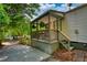 Inviting front porch featuring a cozy seating area and lush hanging plants at 1149 Avondale Se Ave, Atlanta, GA 30312