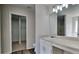 Bright bathroom features a vanity with ample lighting and access to a walk-in closet at 5136 Estonian Dr, Fairburn, GA 30213