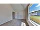 Sunlit bedroom with neutral carpet, vaulted ceiling, and a bright window view at 5136 Estonian Dr, Fairburn, GA 30213