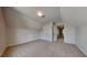 Inviting bonus room features plush carpeting, offering a flexible space for various activities at 5136 Estonian Dr, Fairburn, GA 30213