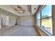 Large main bedroom featuring tray ceilings, a ceiling fan, and plenty of natural light at 5136 Estonian Dr, Fairburn, GA 30213