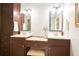 Bathroom boasts a vanity with double sinks, custom lighting, and ample cabinet space at 5322 Seaton Dr, Atlanta, GA 30338
