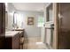 Bathroom showcases vanity with double sinks, tile floor, and modern lighting at 5322 Seaton Dr, Atlanta, GA 30338