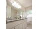 Bright bathroom featuring a large mirror and double sink vanity with storage at 5322 Seaton Dr, Atlanta, GA 30338