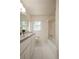 Well-lit bathroom featuring a shower-tub combo and vanity with storage at 5322 Seaton Dr, Atlanta, GA 30338