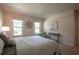 Comfortable bedroom features windows for natural light, a quaint table, and a cozy chair at 5322 Seaton Dr, Atlanta, GA 30338