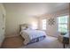 Bright bedroom with neutral tones features two windows for ample natural light and carpeted floor at 5322 Seaton Dr, Atlanta, GA 30338