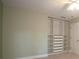 Bedroom with ceiling fan and closet with shelving at 5322 Seaton Dr, Atlanta, GA 30338