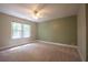Bedroom featuring neutral carpet and green wall at 5322 Seaton Dr, Atlanta, GA 30338
