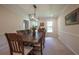 Formal dining room featuring a large wooden table, chairs, and elegant lighting fixture at 5322 Seaton Dr, Atlanta, GA 30338