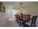 Dining room showcasing a wooden table with chairs and a modern chandelier at 5322 Seaton Dr, Atlanta, GA 30338